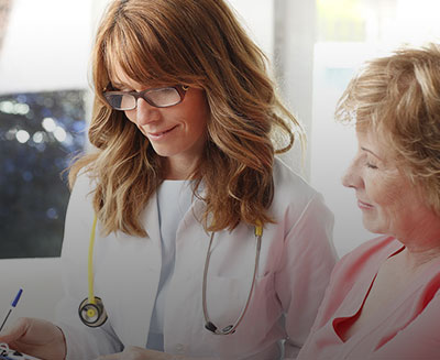 Doctor meeting with patient during consultation